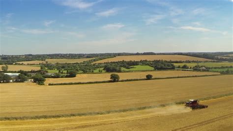 Aerial View Of Uk Countryside And Farmland In Summer High Above Green