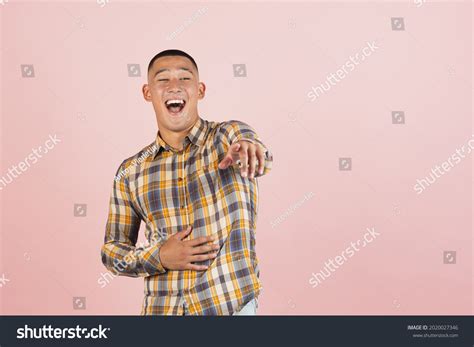 Pointing Laughing Portrait Young Handsome Asian Stock Photo 2020027346