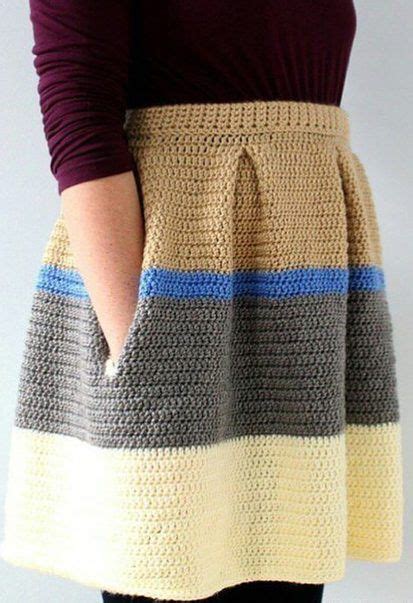 A Woman Is Wearing A Crocheted Skirt With Her Hands In Her Pockets And