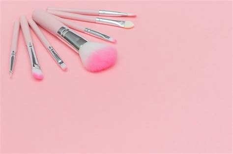 Set Of Pink Makeup Brushes On Pastel Pink Background Premium Photo