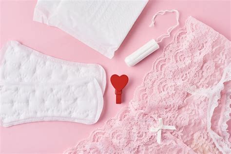 premium photo sanitary pad menstrual cup tampon and panties on a pink