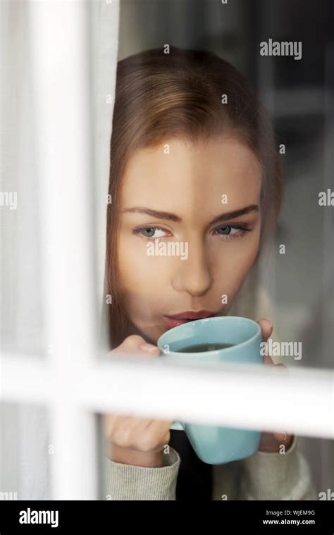 Beautiful Caucasian Woman Drinking Hot Coffee Or Tea And Looking