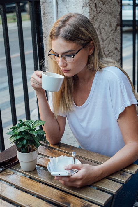 Pretty Blond Woman Having Coffee By Katarina Radovic