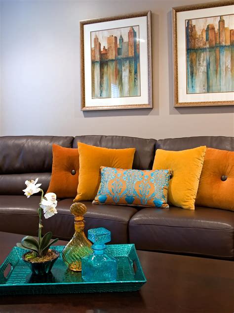 Contemporary Brown Leather Sofa With Orange Throw Pillows