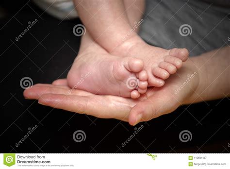 Feet Of Newborn Baby In The Hand Of Mother Stock Image Image Of Foot