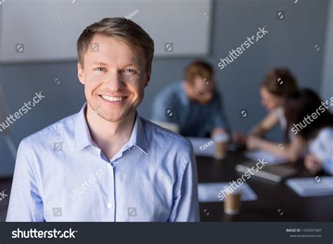 Portrait Smiling Middleaged Male Employee Posing Stock Photo 1165591807