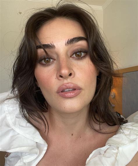 Esra Bilgiç Looks Fierce In A White Ruffled Top And Smokey Eyes Lens
