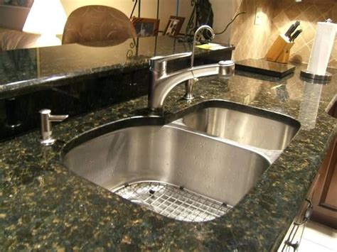 Cabinets can be all dark, or just the bottom cabinets while the top remain a lighter color, or vise versa. Kitchen Ideas With Uba Tuba Granite | Modern kitchen faucet, Green granite countertops