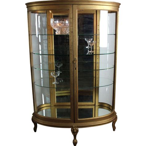 This curved front curio is built in select hardwood solids and veneers with an aged edwardian ii finish. Oval Curved Glass Curio Cabinet c. 1900 from ...