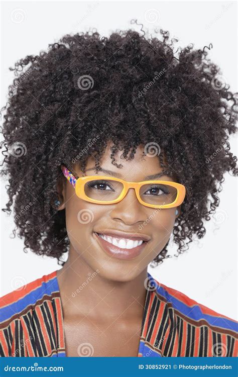 portrait of an african american woman wearing glasses over gray background stock image image