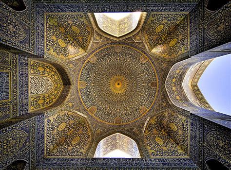 An Intricate Ceiling In The Middle Of A Building With Blue And Gold Tiles On It