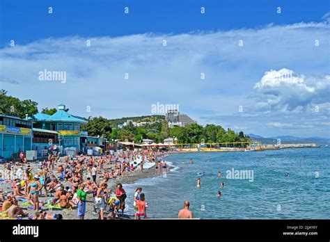 Alushta Crimea Ukraine People On The Public Pebble Beach Near Black