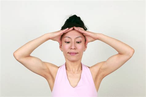 Reduce Frown Lines With This Face Yoga Method Pose