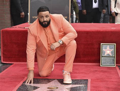 dj khaled suits up in orange sneakers to receive star on hollywood walk of fame with jay z