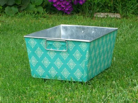 A Useful And Decorative Galvanized Container Covered Made With Lily