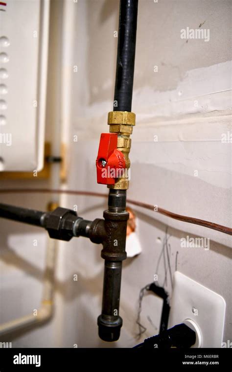 Natural Gas Lines Running To The Water Heater And Furnace Of A