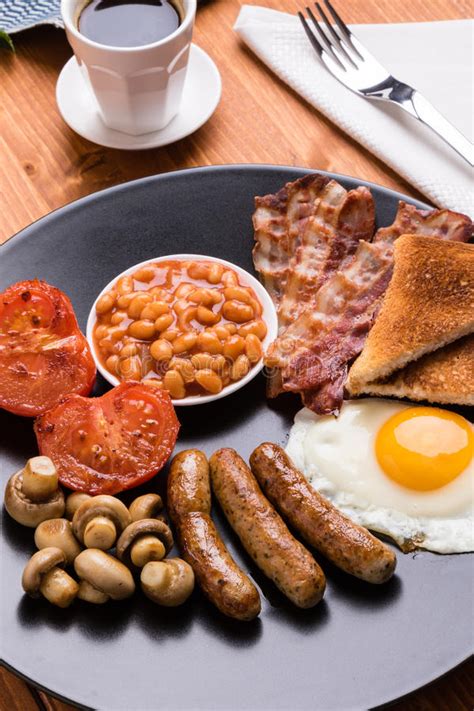 Rustic Full English Breakfast On Black Plate Stock Photo Image Of