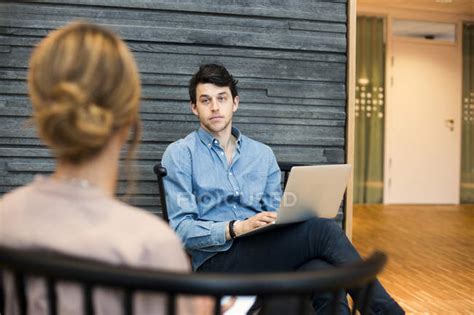 Man Looking At Woman During Meeting — Planning Colleagues Stock