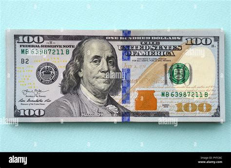 Us Dollar Bills Of A New Design With A Blue Stripe In The Middle Is