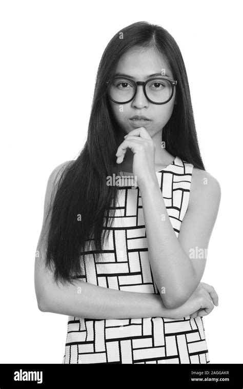 Studio Shot Of Young Asian Teenage Nerd Girl Thinking Stock Photo Alamy