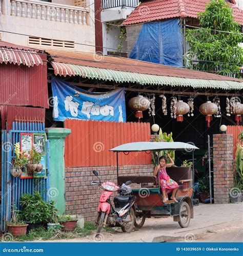 Little Asian Girl Sits In A Moto Rickshaw Near A House With Red Lanterns Editorial Stock Image