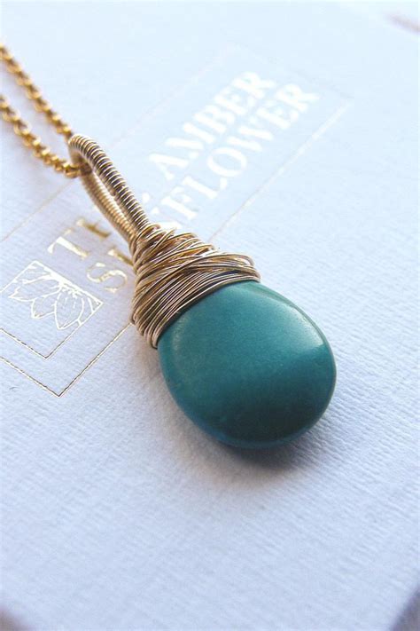 Turquoise Teardrop Wire Wrapped Pendant Necklace In Goldfill Click