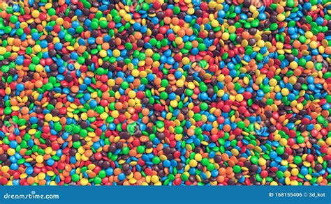 Huge Pile Of Colorful Coated Chocolate Candies Background Stock Photo