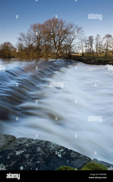 Scenic Rural Landscape River Wharfe Pouring And Tumbling Over Weir