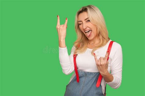 Disobedient Crazy Brunette Woman In Denim Clothes Sticking Out Tongue And Grimacing With Closed