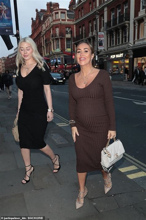 Pregnant Lauryn Goodman Displays Her Growing Bump In A Fitted Midi Dress