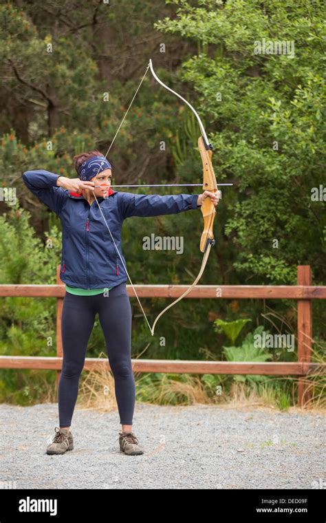 Brunette Practicing Archery Stock Photo Alamy