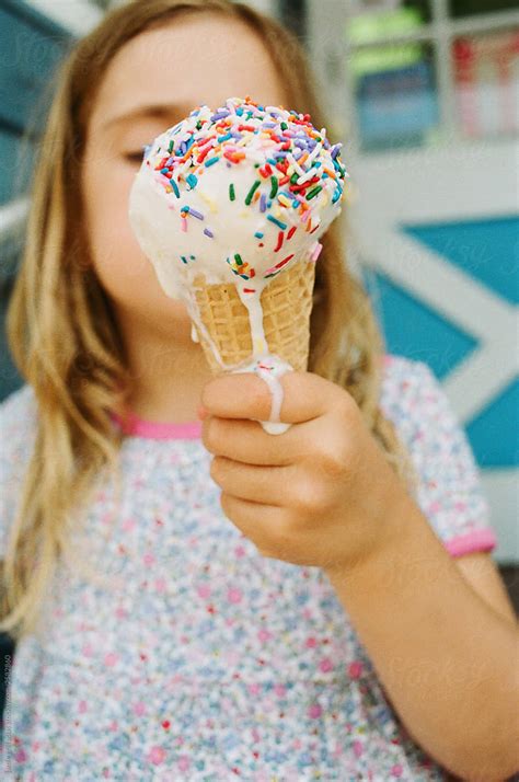Girl Eating Melting Ice Cream Cone By Stocksy Contributor Jamie