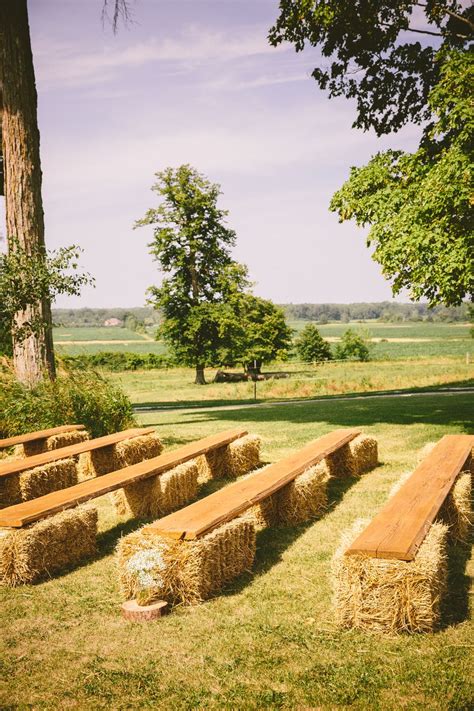 Hales of bay for ceremony guests to sit on Unique Rustic Wedding