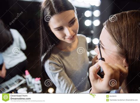 Cheerful Delighted Makeup Artist Using Mascara Stock Photo Image Of