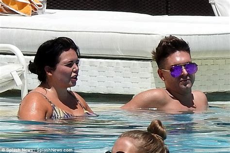 Scarlett Moffatt Slips Into A Number Of Summery Swimsuits As She Relaxes By The Pool In Las