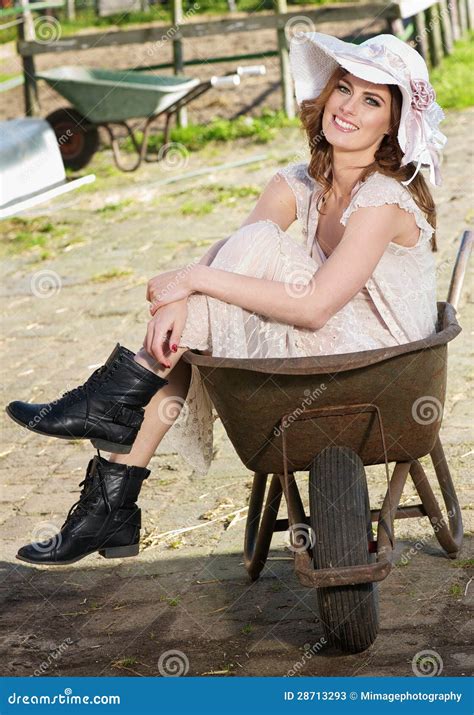Beautiful Bride Sitting In Wheelbarrow Stock Image Image Of