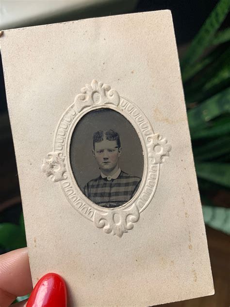 antique tintype portrait in original embossed paper frame