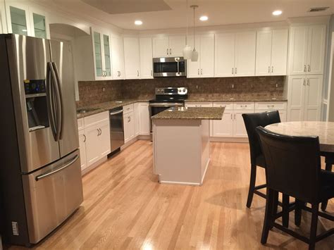 Gold color granite kitchen countertops ideas gold trend. White cabinets, hardwood floors, kitchen, Santa Cecilia ...