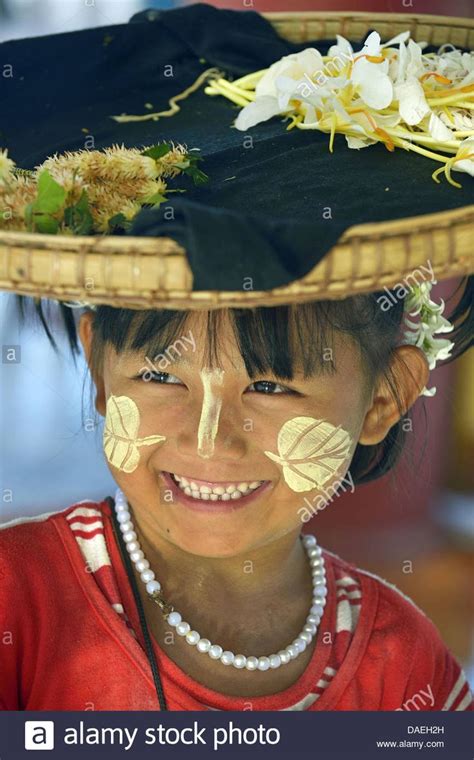 Maybe you would like to learn more about one of these? little flower seller made up with the traditional Burmese ...