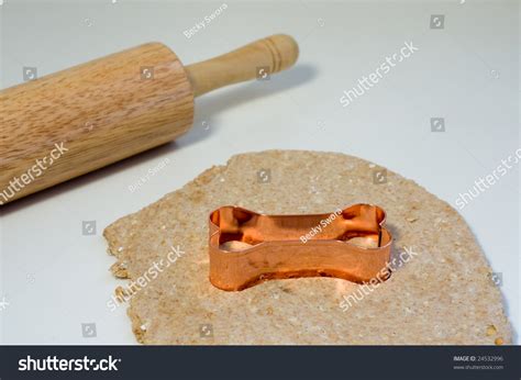 A Dog Bone Shaped Cookie Cutter Rolling Pin And Treat