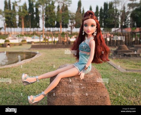 Barbie Doll Sitting On The Rock Stock Photo Alamy