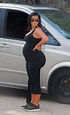 Pregnant Kim Kardashian shows off bump and bum in tight black workout ...