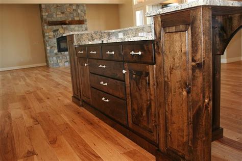 Knotty alder is one of the rustic species we offer at dura supreme cabinetry. Stain-grade knotty alder w/ toe mould | Knotty alder ...