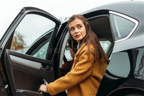 Young Woman Getting Out Of Taxi Stock Image Image Of Transportation