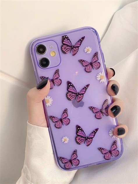 A Womans Hand Holding A Purple Phone Case With Butterflies On It