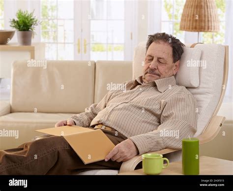Senior Man Sleeping In Armchair Stock Photo Alamy