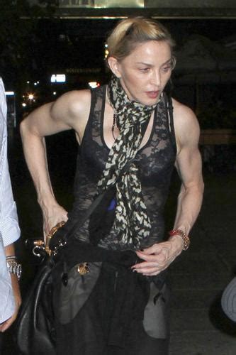 strike a pose 54 year old madonna exposes her muscles flaunts sheer vest