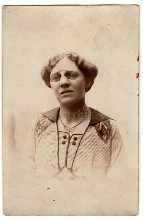 vintage photo shows a mature woman wears vintage antique nose clip glasses retro black and