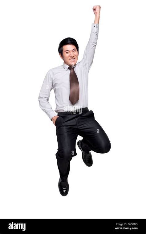 Excited Businessman Jumping In The Air Stock Photo Alamy
