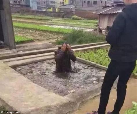 Dog Thief Is Forced To Stand In A Pit Of Excrement As Punishment In